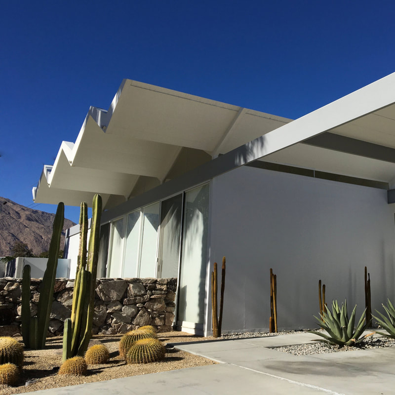 Wexler & Harrison Steel House from a front lower angle with desert landscaping and cacti and succulent plants