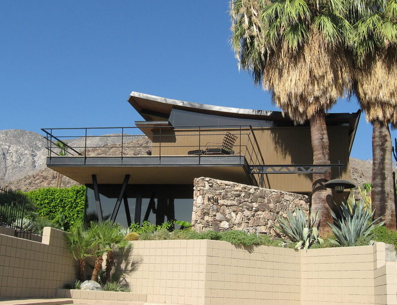 Dr. Franz Alexander House in Palm Springs view from the front with palm trees and landscaping