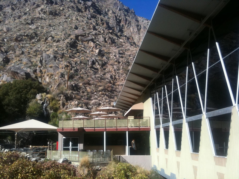 Palm Springs Arial Tramway building with outdoor patio and Coachella Valley mountains in the background